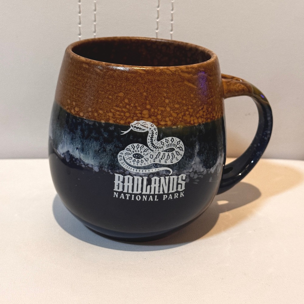 large Badlands National Park souvenir coffee mug brown blue rattlesnake